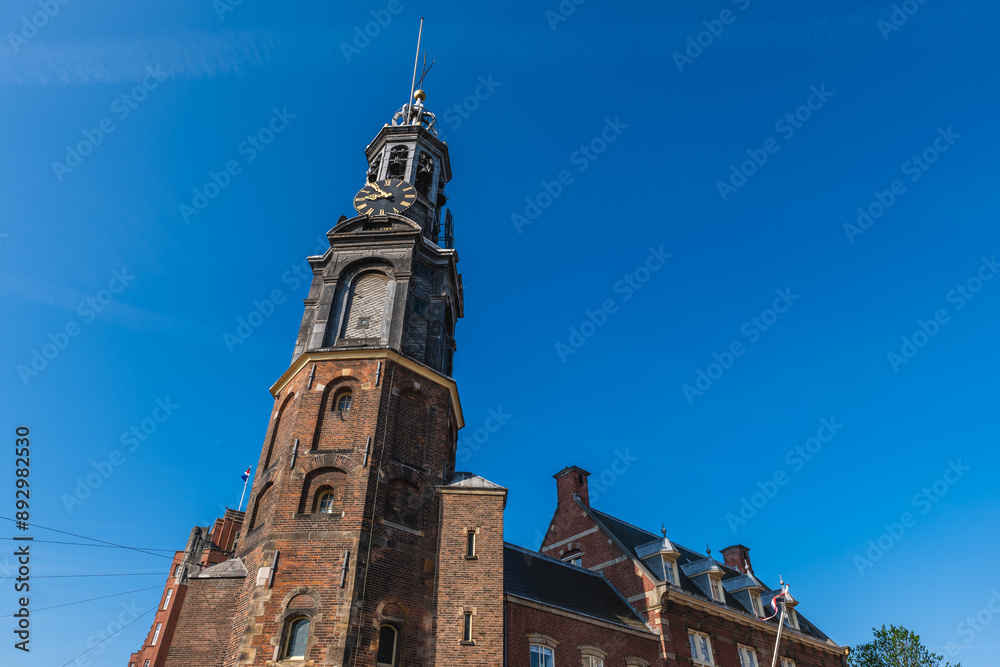 Obraz premium The Munttoren or Munt, is the Mint Tower located on Muntplein square in Amsterdam, Netherlands