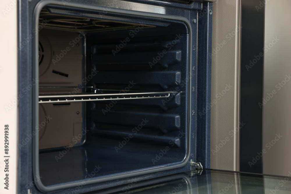 Fototapeta premium Open electric oven in kitchen. Cooking appliance