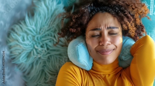 woman experiencing menstrual pain using hot water bottle for relief