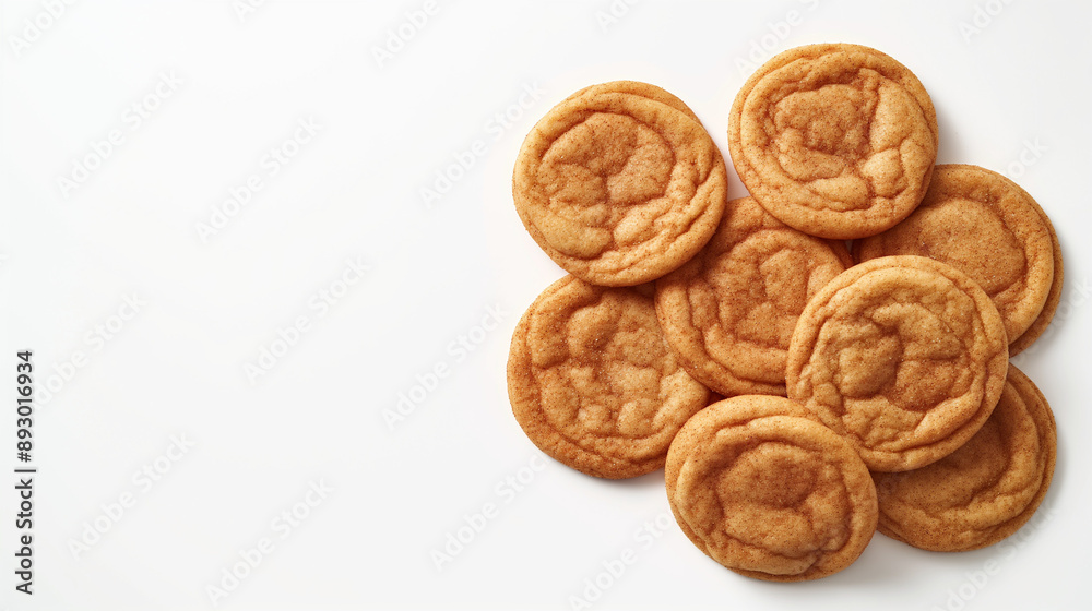An image of classic snickerdoodle cookies, featuring golden-brown, slightly crinkled tops dusted with a generous coating of cinnamon sugar, set against a clean white background An image of classic snickerdoodle cookies, featuring golden-brown, slightly crinkled tops dusted with a generous coating of cinnamon sugar, set against a clean white background