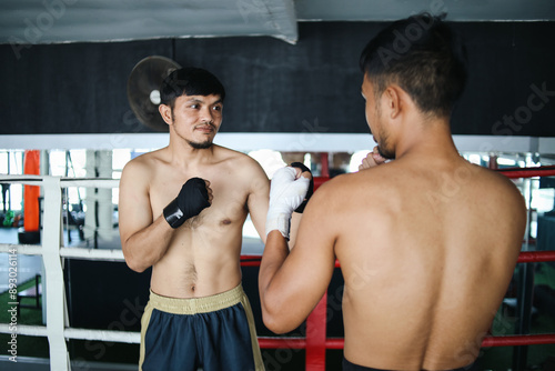 Portrait Asian Fighters Men With Elastic Sport Bandage Standing In Boxing Ring photo