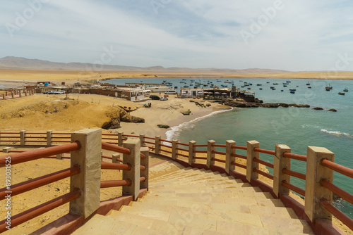 Paracas, Peru: View of the famous Lagunillas beach that is lined with seafood restaurants along the Pacific Ocean in Peru in south America photo