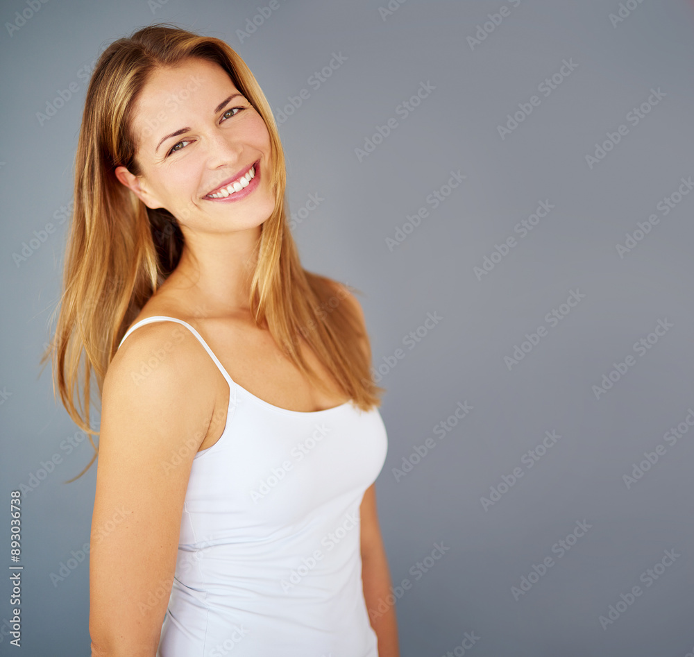 Model, portrait and confidence with hair, beauty and hairstyle for cosmetic care and glow. Woman, smile and keratin treatment for salon, shine and aesthetic mockup isolated on gray studio background Model, portrait and confidence with hair, beauty and hairstyle for cosmetic care and glow. Woman, smile and keratin treatment for salon, shine and aesthetic mockup isolated on gray studio background