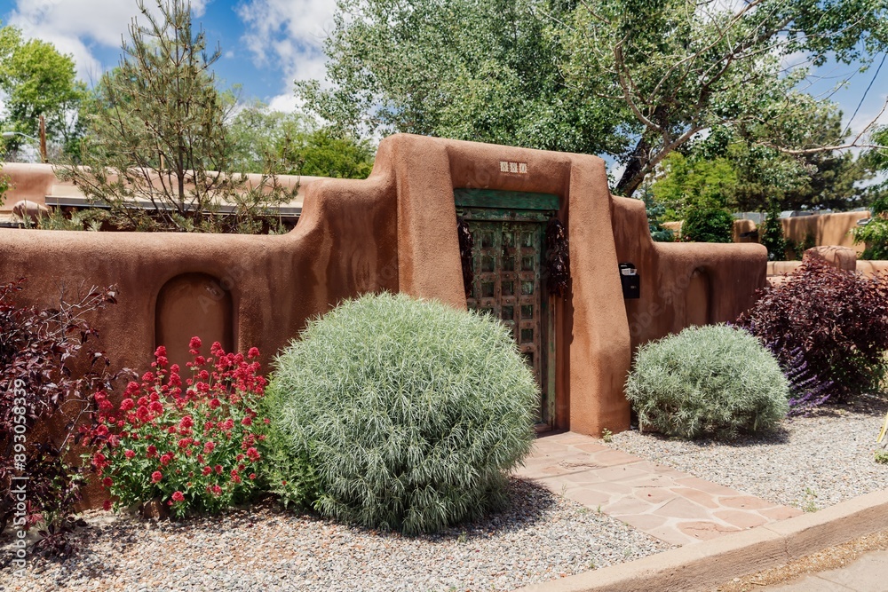 Fototapeta premium Fence of a Pueblo style house in Santa Fe, New Mexico, United States Of America.