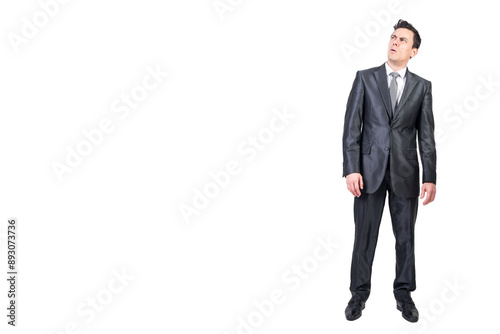 Unsure businessman in suit in studio. White background.