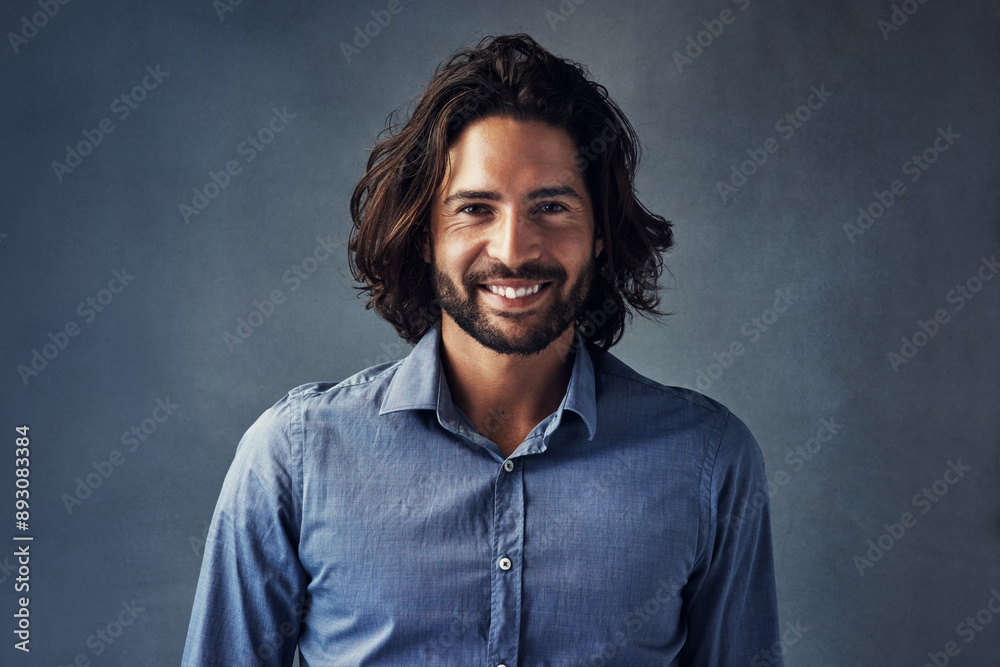 Φωτογραφία Business man, long hair and smile in studio portrait with confidence, pride and formal shirt by background