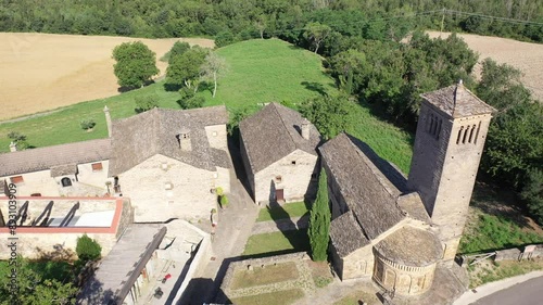 Aerial view of bell tower and apse of the Mozarab Pre-Romanesque or Romanesque Church of San Pedro de Larrede in the Serrablo Region. Aragon. Spain. High quality 4k footage photo