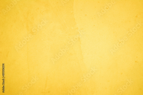 Yellow concrete stone texture for background in summer wallpaper. Cement and sand wall of tone vintage minimal. Concrete abstract wall of yellow color, cement texture white blank for home decor.