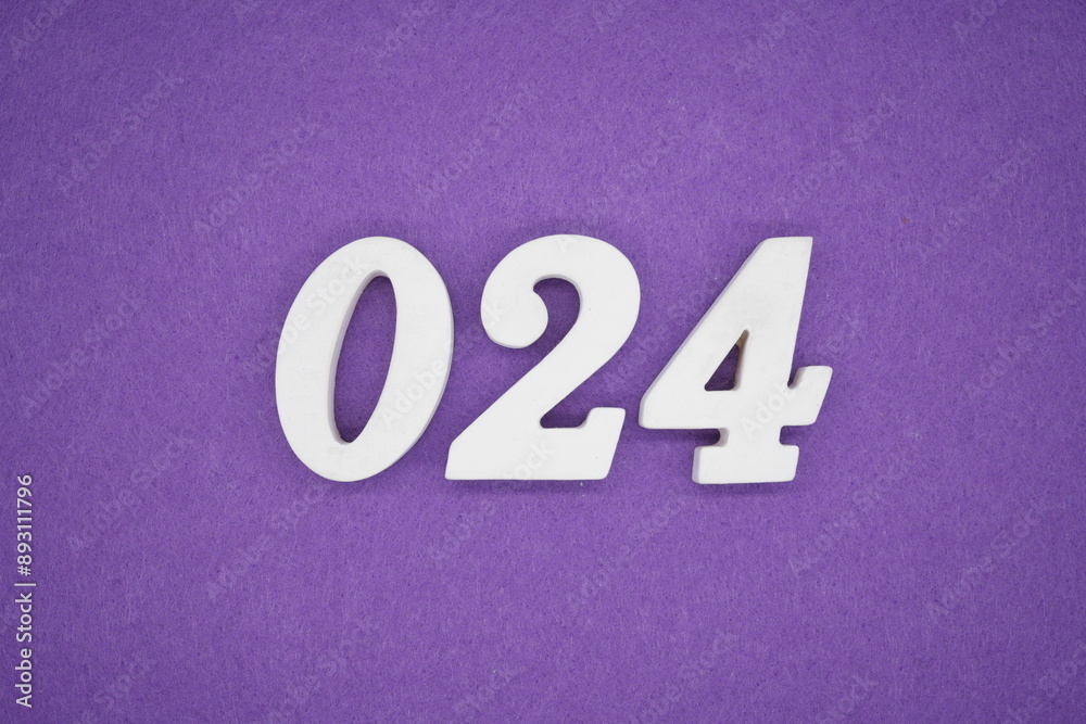 The numbers are made of white paint wood, placed on the background as a purple paper.