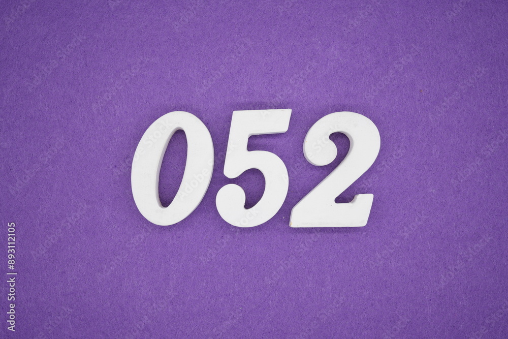 The numbers are made of white paint wood, placed on the background as a purple paper.