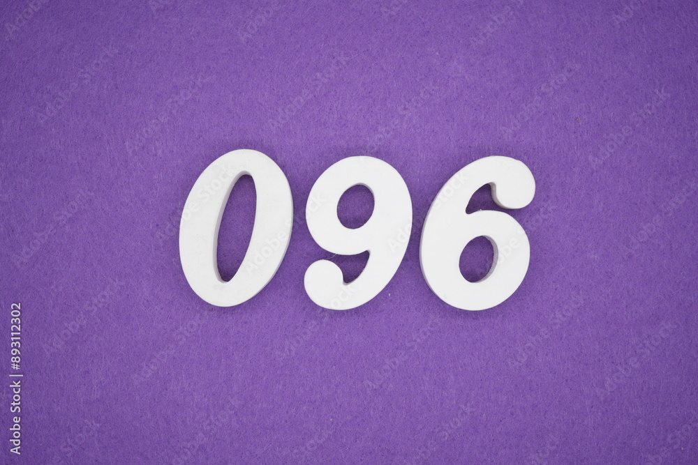 The numbers are made of white paint wood, placed on the background as a purple paper. The numbers are made of white paint wood, placed on the background as a purple paper.