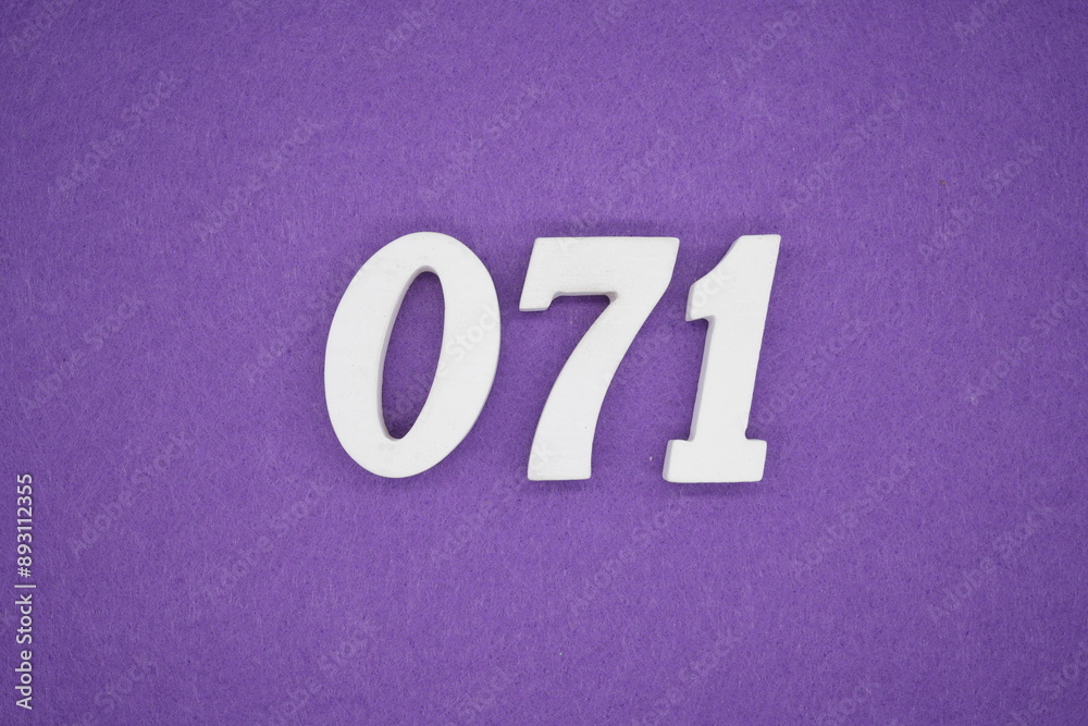 The numbers are made of white paint wood, placed on the background as a purple paper. The numbers are made of white paint wood, placed on the background as a purple paper.