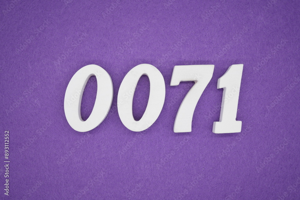The numbers are made of white paint wood, placed on the background as a purple paper. The numbers are made of white paint wood, placed on the background as a purple paper.