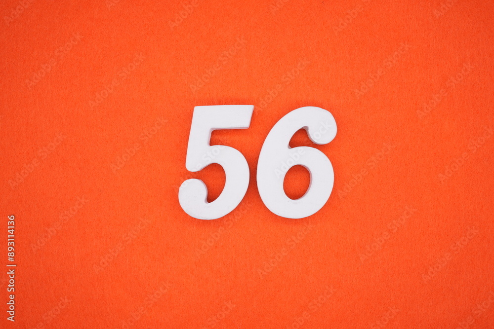 The numbers are made of white painted wood. Placed on the floor was orange paper. The numbers are made of white painted wood. Placed on the floor was orange paper.