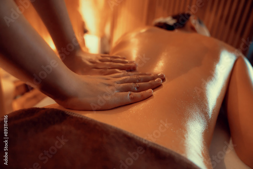 Wallpaper Mural Closeup woman customer enjoying relaxing anti-stress spa massage and pampering with beauty skin recreation leisure in warm candle lighting ambient salon spa at luxury resort or hotel. Quiescent Torontodigital.ca