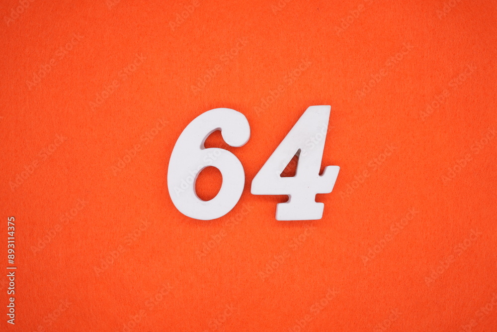 The numbers are made of white painted wood. Placed on the floor was orange paper. The numbers are made of white painted wood. Placed on the floor was orange paper.