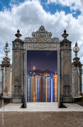 The eastern gate with Galata Tower, Galata Bridge, Karakoy district and Golden Horn at night, istanbul - Turkeye photo