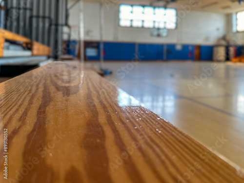 Obraz na płótnie Close-up of wooden bleachers in an empty school basketball court, gymnasium