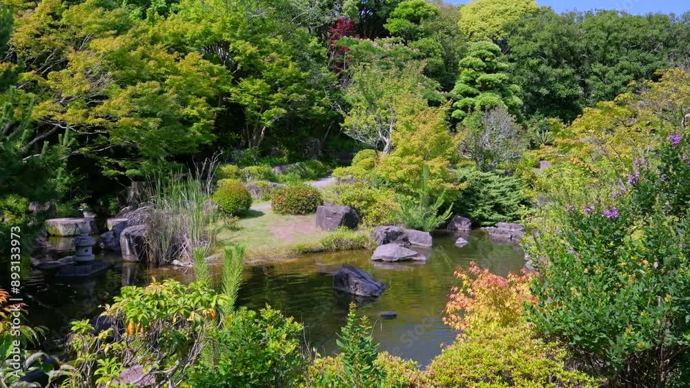 Slow cinematic push in at typical Japanese landscape garden Slow cinematic push in at typical Japanese landscape garden