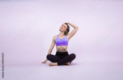 Full body length gaiety shot athletic and sporty woman doing healthy and meditative yoga exercise workout posture on isolated background. Healthy active and body care lifestyle