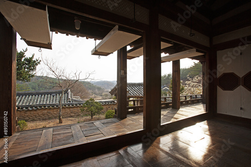 Waryong-myeon, Andong-si, Gyeongsangbuk-do, South Korea - April 14, 2011: Spring and afternoon view of wood floor and pillars of a tiled house at Andong Gunja village 