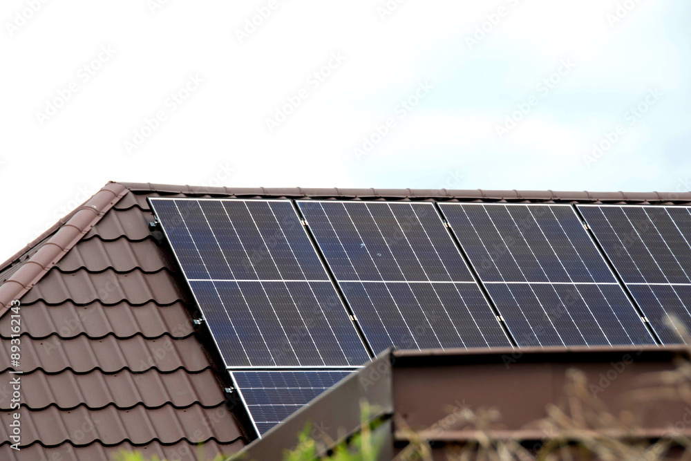 Fototapeta premium Installing a Solar Cell on a Roof.