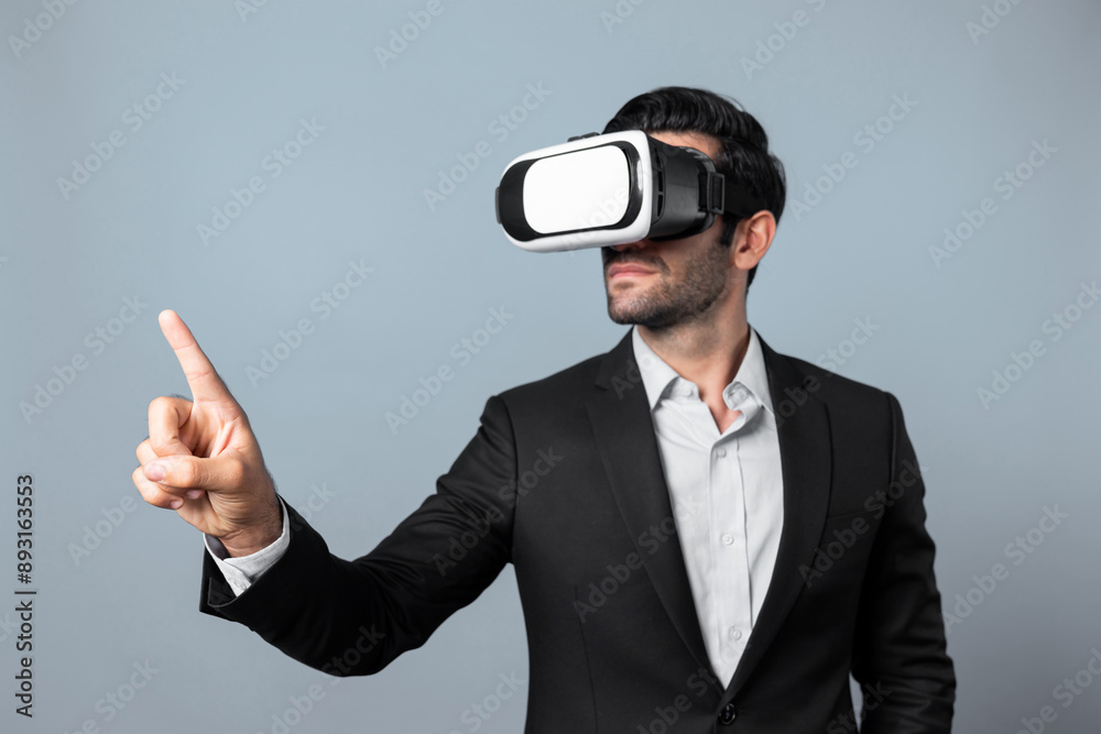 Project manager with virtual reality glasses looking at data analysis while analyzing and pointing data. Skilled business man using VR goggle and digital innovation while enter metaverse. Deviation. Project manager with virtual reality glasses looking at data analysis while analyzing and pointing data. Skilled business man using VR goggle and digital innovation while enter metaverse. Deviation.