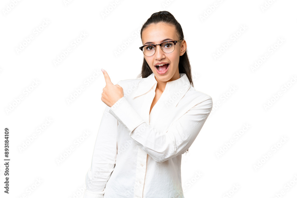 Young Arabian woman over isolated chroma key background surprised and pointing side Young Arabian woman over isolated chroma key background surprised and pointing side