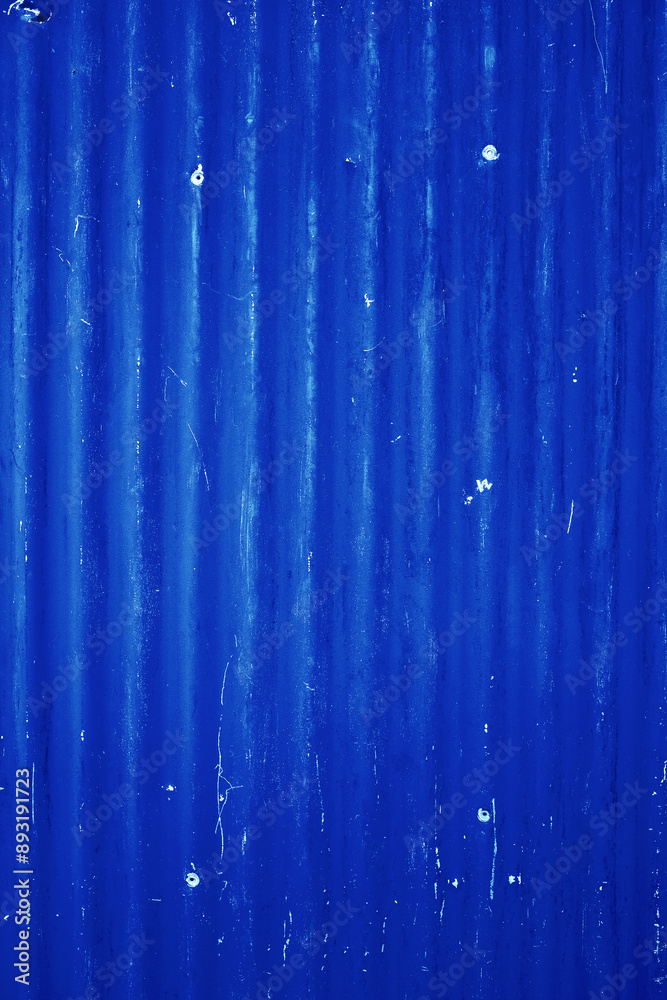 Old corrugated metal panel wall painted in a blue paint. Old weathered wall background concept Old corrugated metal panel wall painted in a blue paint. Old weathered wall background concept