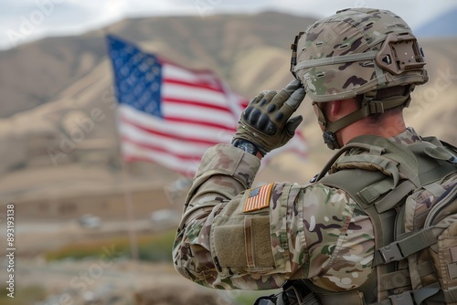 Portrait of an American soldier saluting with the US flag in the background, close up. 