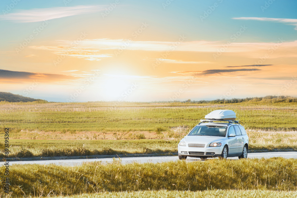 Car with roofbox in nature trip at summer Car with roofbox in nature trip at summer