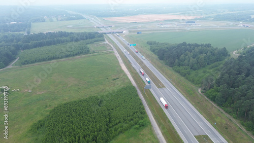 Aerial shot of white truck on empty country road photo