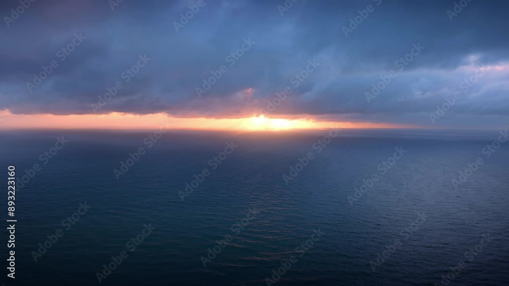 Tranquil dreamy sunset with heavy clouds off the coast piha, Auckland, New Zealand. Tranquil dreamy sunset with heavy clouds off the coast piha, Auckland, New Zealand.
