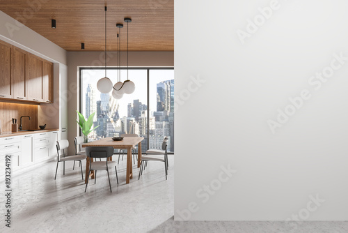 Wooden home kitchen interior with eating table, cabinet and window. Mockup wall