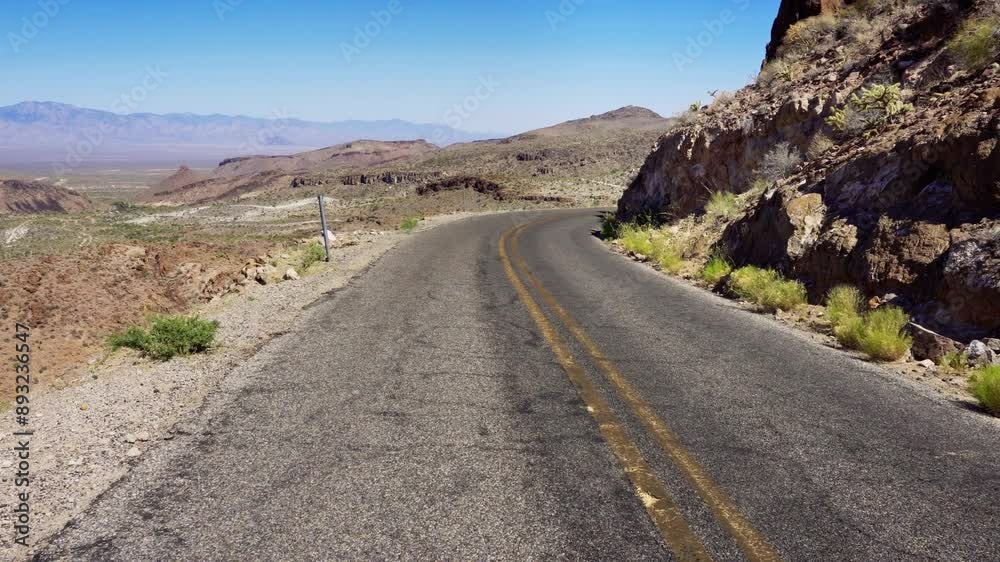 Walking along historic Route 66 in the Black Mountains near Oatman, Mohave County, Arizona. 4K UHD video. Walking along historic Route 66 in the Black Mountains near Oatman, Mohave County, Arizona. 4K UHD video.