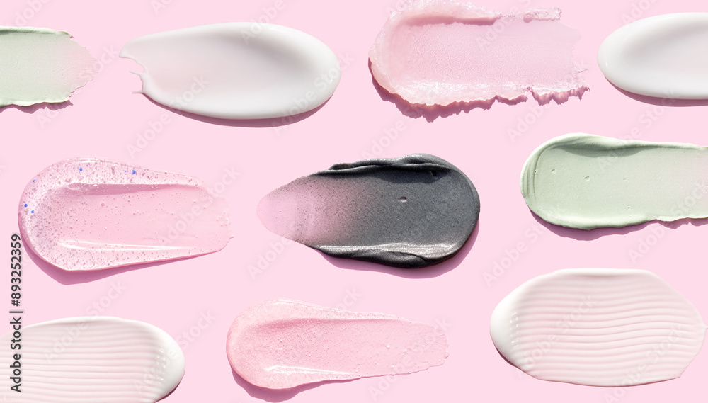 creamy texture of cosmetic samples on pink background creamy texture of cosmetic samples on pink background