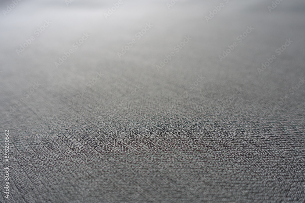 Macro of light gray polyester fabric with herringbone pattern Macro of light gray polyester fabric with herringbone pattern