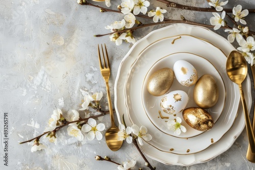 Obraz na płótnie table setting with white plate, golden cutlery, easter eggs and spring branches w salonie
