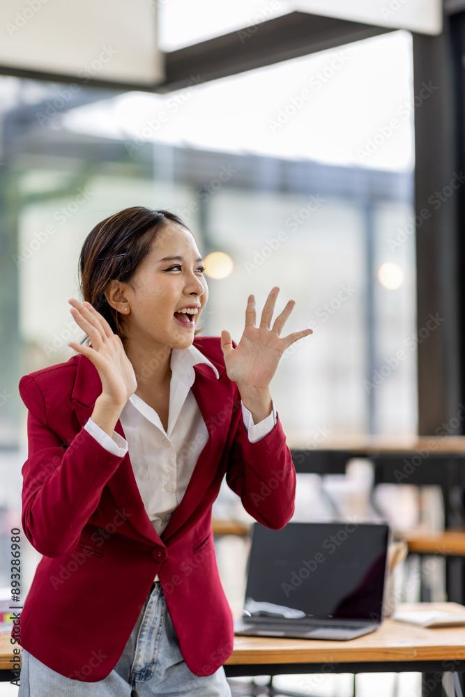 Portrait of happy attractive Asian woman smiling broadly camera with enthusiastic attitude at the office Portrait of happy attractive Asian woman smiling broadly camera with enthusiastic attitude at the office