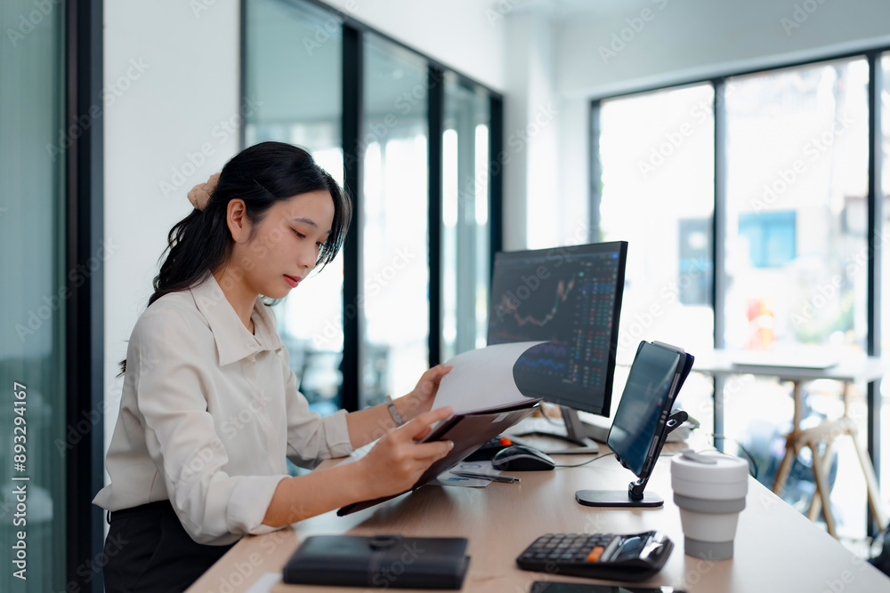 Business analyst calculating turnover figures in office Business analyst calculating turnover figures in office