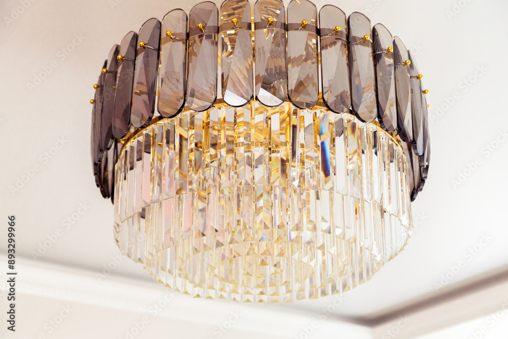 Elegant Crystal Chandelier with Modern Design Details. A close-up of an elegant crystal chandelier showcasing its intricate design and luxurious details, adding a touch of sophistication. Elegant Crystal Chandelier with Modern Design Details. A close-up of an elegant crystal chandelier showcasing its intricate design and luxurious details, adding a touch of sophistication.