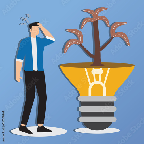 Sad businessman leaning on dead light bulb idea with dead plants, unsustainable business ideas concept, industries that do not use environmentally friendly energy or renewable energy