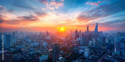 Vibrant Cityscape with Towering Skyscrapers at Dramatic Sunset