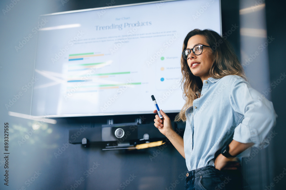 Female team leader speaking on a trending products report in a business conference meeting Female team leader speaking on a trending products report in a business conference meeting
