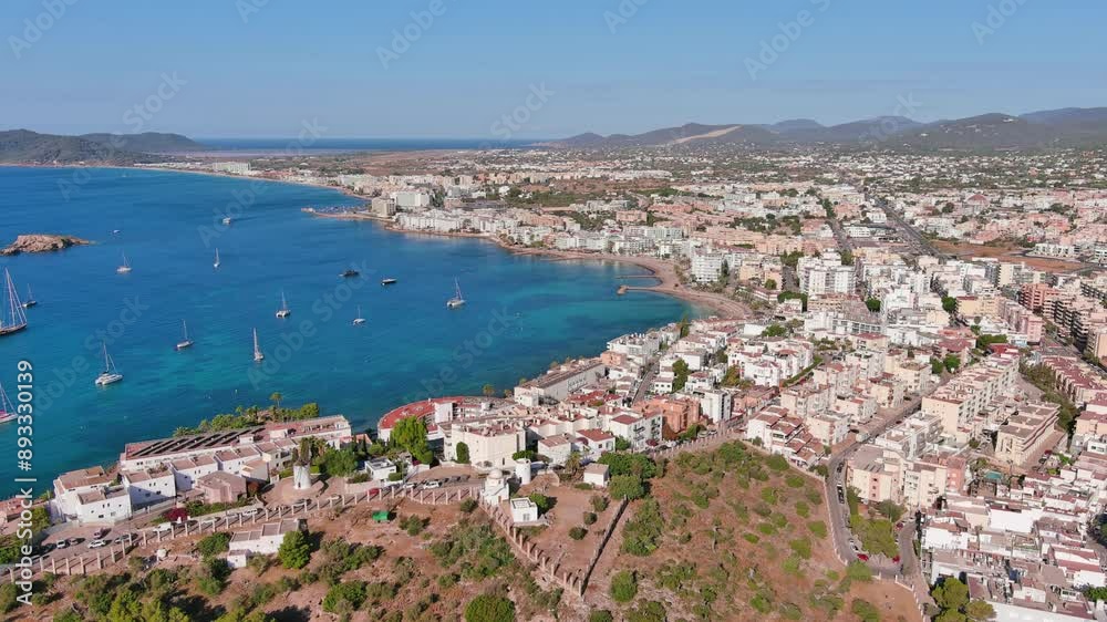 Ibiza Town, Spain: Aerial view of capital city of Ibiza island, Figueretas Beach (Platja de ses Figueretes), summer day with clear blue sky - landscape panorama of Europe from above
Ibiza Town, Spain: Aerial view of capital city of Ibiza island, Figueretas Beach (Platja de ses Figueretes), summer day with clear blue sky - landscape panorama of Europe from above