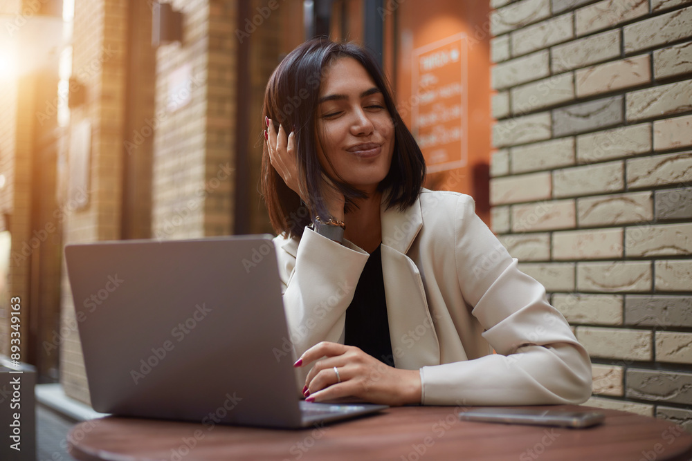 Young happy lucky female student feeling like excited winner while holding mobile phone. Successful businesswoman. freelancer. emotions Young happy lucky female student feeling like excited winner while holding mobile phone. Successful businesswoman. freelancer. emotions