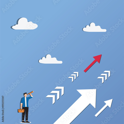 Businessman holding a telescope standing looking at the red arrow up toward career success