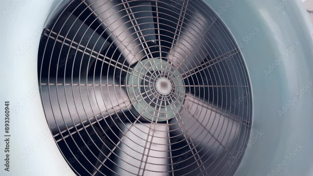 Close-up of a large, gray, industrial fan