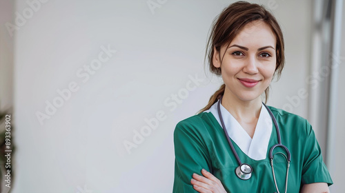 Woman nurse or doctor professional standing wearing green dress