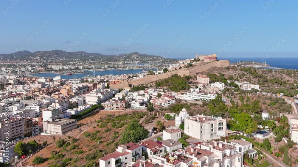 Ibiza Town, Spain: Aerial view of capital city of Ibiza island, Castle of Ibiza (Castell d'Eivissa or Almudaina) towering over Eivissa Harbour, summer day - landscape panorama of Europe from above
Ibiza Town, Spain: Aerial view of capital city of Ibiza island, Castle of Ibiza (Castell d'Eivissa or Almudaina) towering over Eivissa Harbour, summer day - landscape panorama of Europe from above